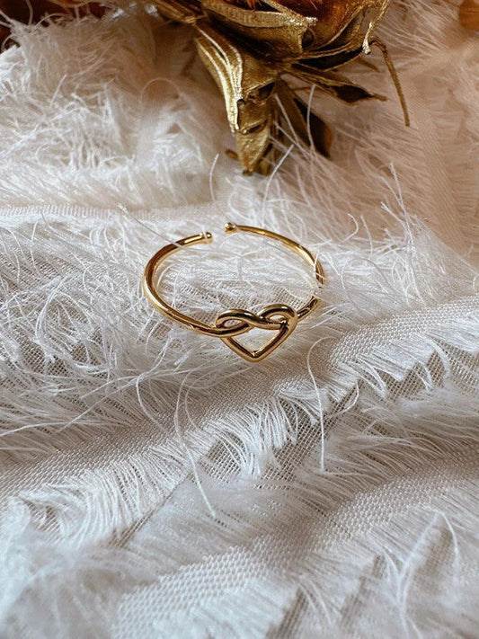 Adjustable ring worn on a finger, gold plated band