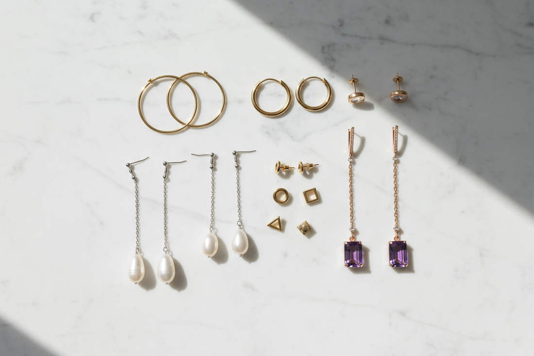 Assortment of stud, hoop and drop earrings displayed together