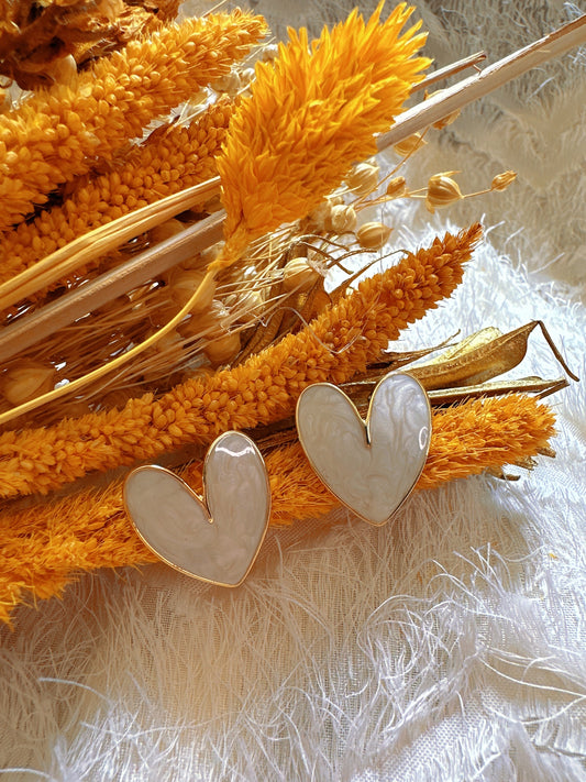 Heart shaped creamy color earrings